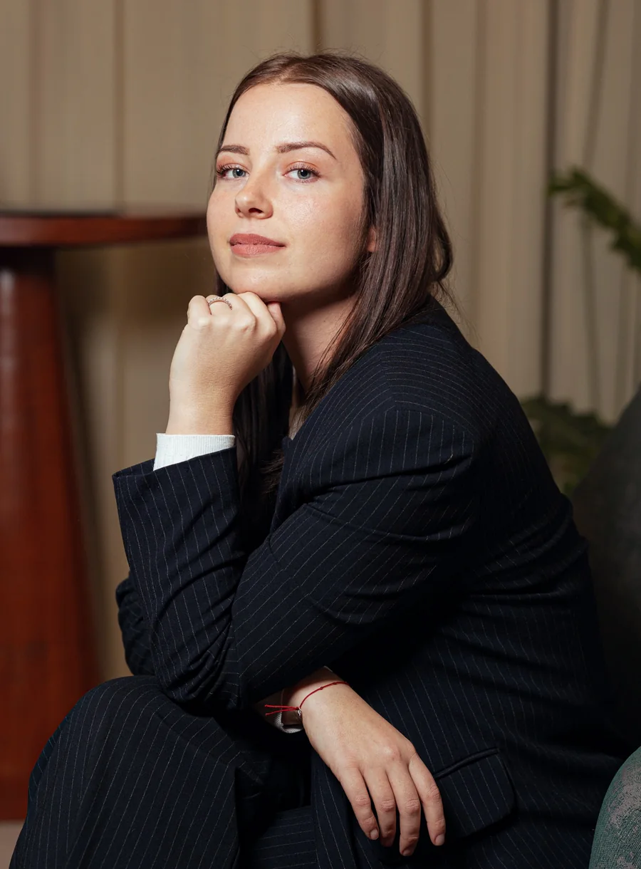 Anđela Čović sitting, chin resting on her hand